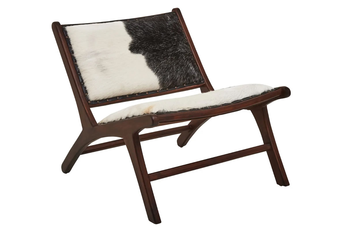 View Incha Goat Hide Chair Solid Teakwood Frame Genuine Black And White Goat Hide Airy Structure Padded Cushioning Delivered Assembled information