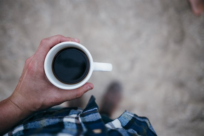 man holding coffee