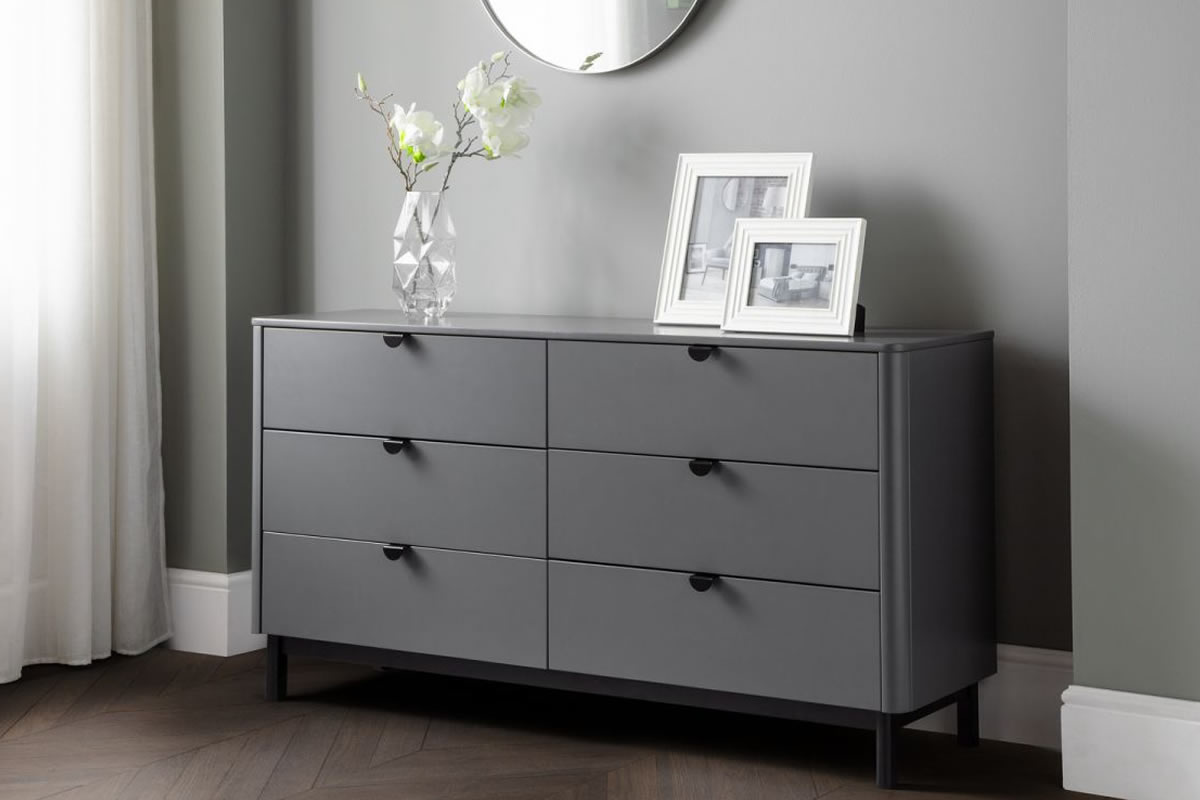 View Modern Grey 6 Wide Drawer Bedroom Storage Chest Modern Retro Style Rounded Corners Satin Grey Finish Black Pull Handles Chloe Julian Bowen information