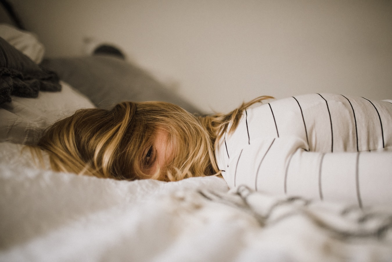 woman laying on bed